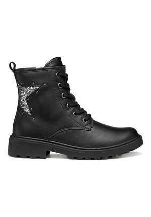 Bottines noires en simili cuir, avec une étoile argentée pailletée, bout rond et semelle en caoutchouc épaisse avec grip.