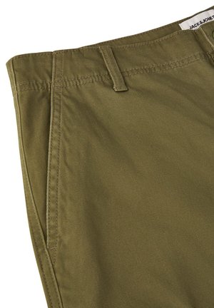 Olive green chinos with a smooth texture, featuring a flat front, side pockets, and a belt loop, stitched with matching thread.