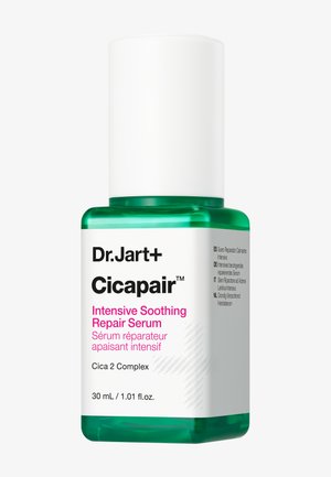 Siero Riparatore Lenitivo Intensivo Dr. Jart+ Cicapair in una bottiglia trasparente da 30 mL. Presenta un tappo cilindrico bianco e una base in vetro verde, etichettata con testo.
