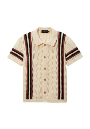 Cardigan court de couleur crème à manches courtes avec un tricot texturé, présentant des rayures verticales marron et noires et des boutons marron sur le devant.