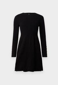 Mustad pikad varrukad kudum dresses, millel on ribbed ülemine keha, laienev seelik ja väikesed pärlitooted varrukate mansettides.