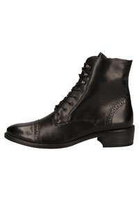 Stivali ankle in pelle nera con punta rotonda, design con lacci e accenti perforati decorativi sui lati e sul retro. Tacco basso.