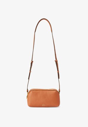 Tan leather crossbody bag with a textured surface, zip closure, and adjustable strap. Features gold hardware and minimalist design.