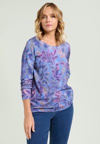 Pullover con motivo floreale blu, maniche lunghe, che presenta sfumature di rosa, viola e verde. Tessuto morbido; vestibilità comoda.