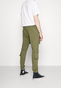 Pegador Kapsáče - olive