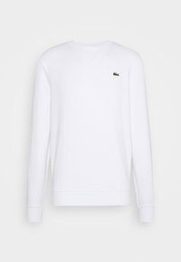 Sudadera blanca con escote en V, mangas largas y puños y bajo acanalados. Presenta un logo verde de Lacoste en el lado izquierdo del pecho. Material de algodón.