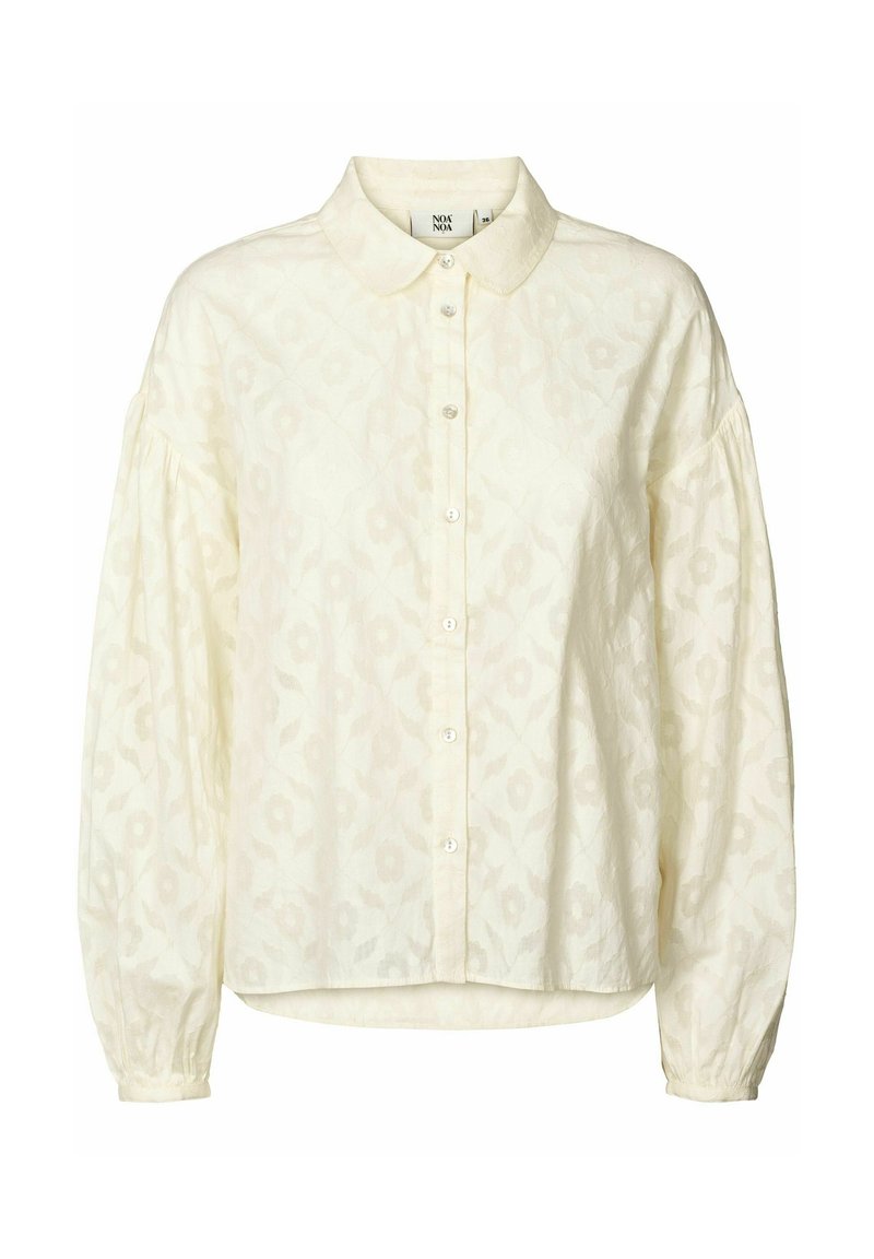 Crèmekleurige blouse met een kraag, gestructureerde stof, knopen aan de voorkant en puffige lange mouwen. Subtiel bloemenpatroon overal.