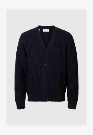 Marineblauwe V-hals cardigan met een gestructureerd breipatroon, zwarte knopen, ribbels bij de manchetten en onderkant, en een ontspannen pasvorm voor comfort.