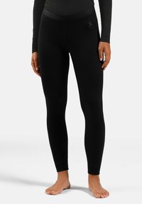 Black leggings made from a stretchy, smooth fabric, featuring a wide waistband and a small logo on the hip. Ankle-length design with no patterns.