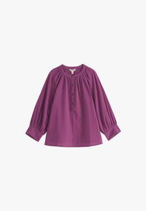Lila Langarmbluse mit rundem Ausschnitt, vorderer Knopfleiste, gerafften Details und weiten Ärmeln. Hergestellt aus leichtem Stoff.