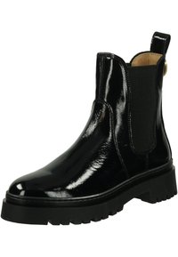 Black patent leather Chelsea boot with elastic side panels, round toe, and a thick black rubber sole featuring a jagged tread pattern.