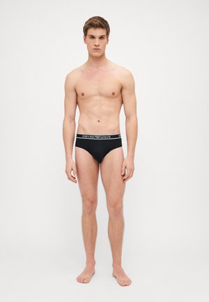 Slips neri con un ampio cinturino elastico che presenta il logo "Emporio Armani". Tessuto liscio, design aderente e stile minimalista.