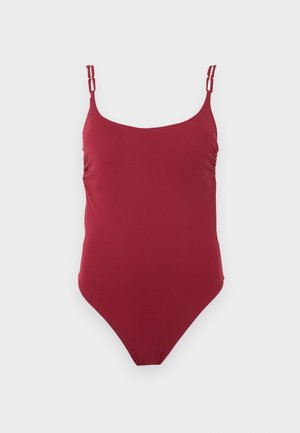 Κόκκινο ολόσωμο μαγιό με λεπτούς διπλούς ρυθμιζόμενους ράντες στους ώμους και ελαφριά ρυτίδωση στα πλάγια.