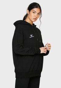SQUATPROOF SP LEFT COMFY ACTIVE PUMP COVER  - Jersey con capucha - black