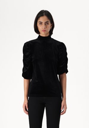 Black velvet top with a high collar and puffed short sleeves. The fabric has a smooth texture, creating a soft sheen.