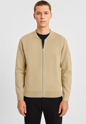 Strickjacke - beige