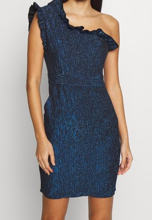 One-shoulder dress in navy with metallic blue thread. Features a ruffled neckline and a fitted waist, knee-length with a subtle sheen.
