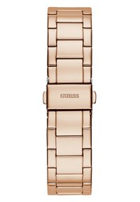 Roségoldfarbene Metalluhr mit einem Gliederarmband-Design. Verfügt über einen Verschluss mit dem eingravierten Markennamen „GUESS“. Glatte, glänzende Oberfläche.