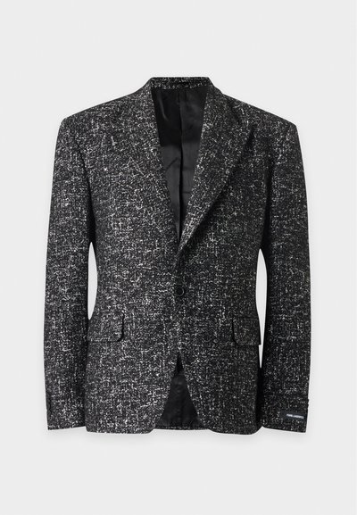 Veste noire et blanche texturée à un bouton, avec revers crantés, poches à rabat et doublure intérieure en satin noir.