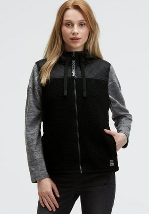 Black and gray fleece vest with a quilted upper section, zip closure, adjustable hood, and side pockets. Notable logo at the collar.