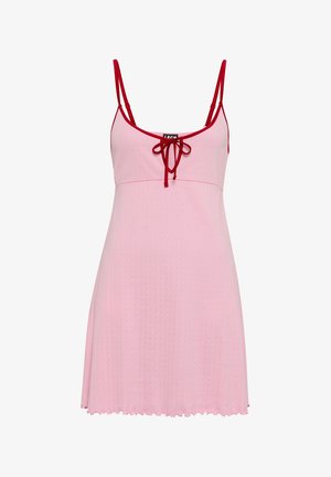 Sleeveless light pink dress with thin red straps, red trim, and front tie detail, featuring a subtle textured pattern and flared hem.