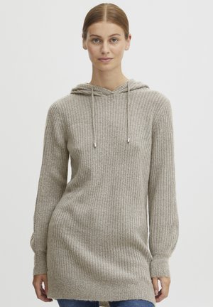 Light beige knitted hoodie with ribbed texture, long sleeves, and a front pocket. Features a drawstring hood and a relaxed fit.