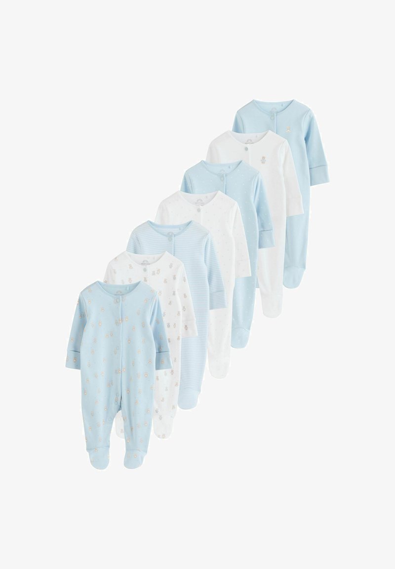 Syv langærmede babyheldragter i blå og hvid med bamsemønstre, striber og prikker, arrangeret i en faldende række.