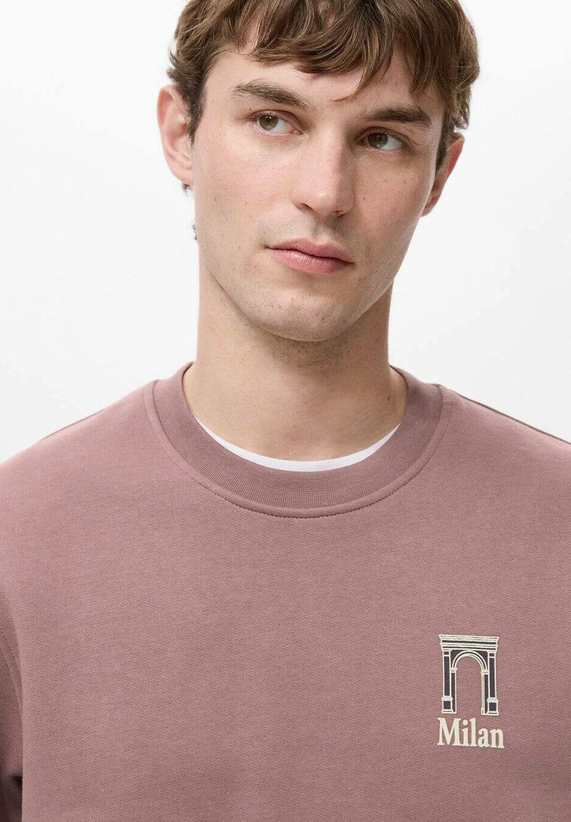 Rosa Sweatshirt mit Rundhalsausschnitt und gesticktem Design eines Bogens mit dem Schriftzug "Milan". Weiche Textur, lässige Passform.