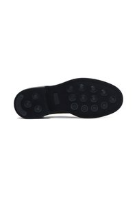 Suela de zapato de goma negra con patrones de trazado circulares, bordes lisos y una ligera curva en la zona de los dedos para mejorar el agarre y la flexibilidad.