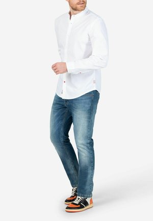 Jeans Tapered Fit - blau
