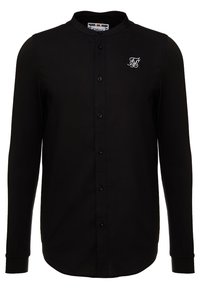 Maglietta nera a maniche lunghe con colletto rialzato, dotata di chiusura a bottone e piccolo logo ricamato bianco sul petto. Tessuto dalla consistenza liscia.