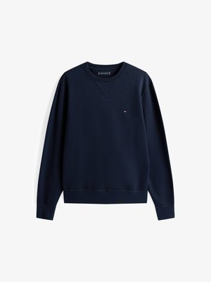 Navy zilā džempers mīkstā kokvilnas maisījumā, ar apaļu kakla izgriezumu, ribotām piedurknēm un mazu logotipu uz krūšu daļas. Gluda tekstūra.