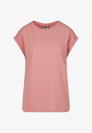 Rozā kokvilnas T-krekls ar īsām rullējamām piedurknēm, apaļu kakla izgriezumu, brīvu piegriezumu un taisnu apakšmalu. Viegls un mīksts tekstūras.