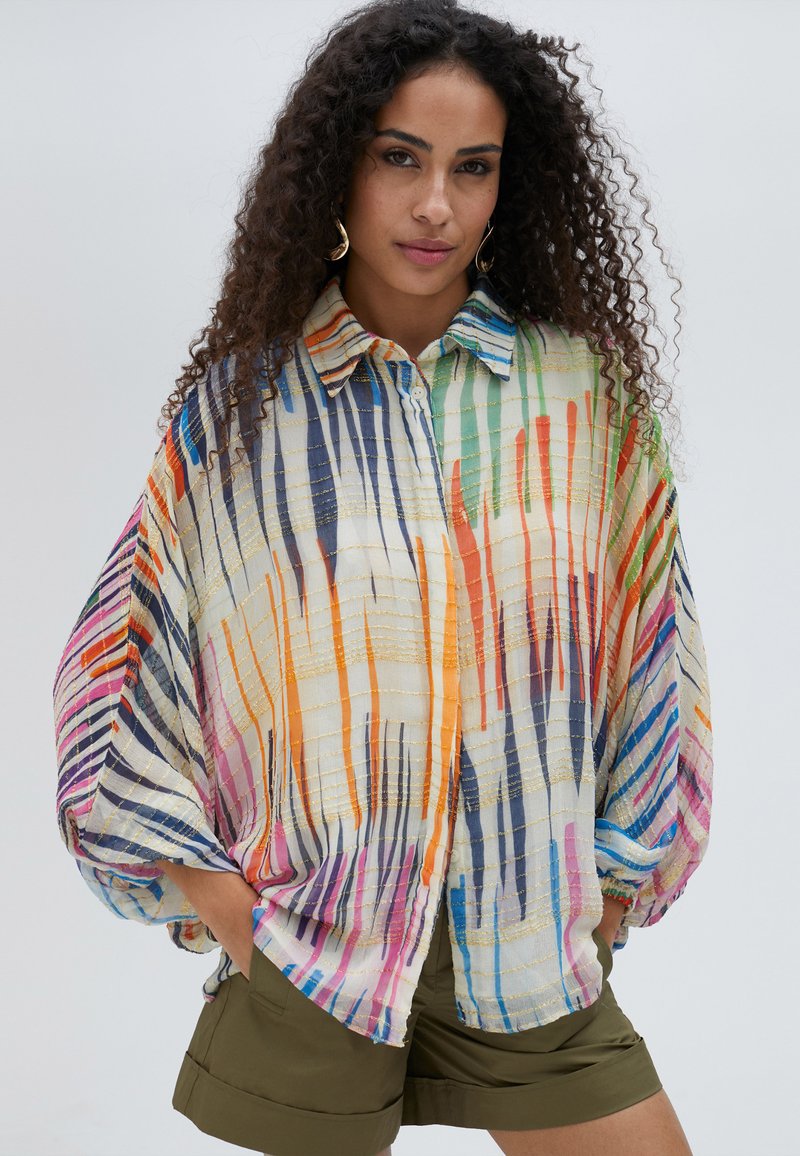 Multicolor sheer blouse with bold vertical stripes in various colors, lightweight fabric, button-up front, and a relaxed fit.