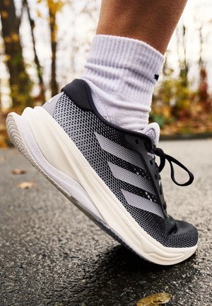 adidas Performance SUPERNOVA SOLUTION - Road running shoes - core black/halo silver/dash grey