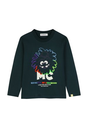 Chemise sombre à manches longues avec un visage de monstre coloré et le texte « Monster of Ceremony Limited Edition Billieblush ».