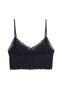 Bralette bleu marine en tissu doux avec bordure en dentelle le long de l'encolure et de l'ourlet, doté de bretelles en satin réglables pour un ajustement parfait.