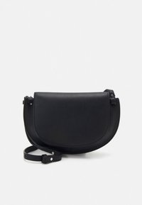 Black leather crossbody bag with a curved shape, flap closure, and adjustable strap. Smooth texture with minimal hardware accents.