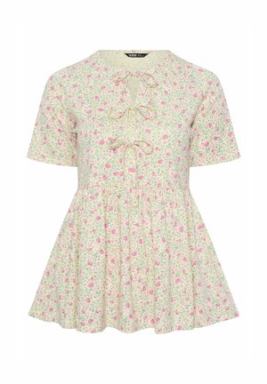 Blusa crema a maniche corte con stampa floreale rosa, tre fiocchi frontali annodati e orlo a peplo svasato.