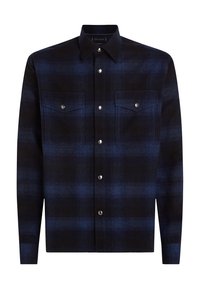 Dark blue plaid shirt made from textured fabric, featuring a pointed collar, snap buttons, and two chest pockets.