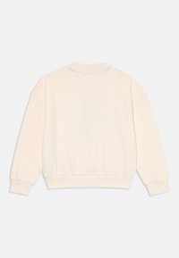 Πουλόβερ σε ανοιχτό κρέμ, με χαλαρή εφαρμογή, ριμπ μανσέτες και στρίφωμα, απαλό βαμβακερό υλικό και λεπτομέρεια V-ραφής στην πλάτη.