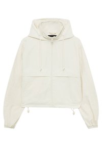 Veste blanche raccourcie avec une capuche à cordon, une fermeture éclair à l'avant et des poignets élastiques. Elle présente un tissu lisse et léger ainsi qu'un design bicolore.