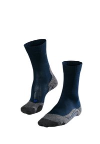 Mörkblå strumpor med en texturerad grå häl och tå. Har en ribbad kant och en förstärkt tå, med en liten blå logotyp nära ankeln.