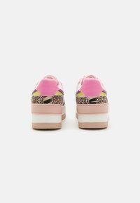Colorful sneakers featuring a mix of pink, purple, and neon accents with a textured animal print detail at the heel and layered sole design.