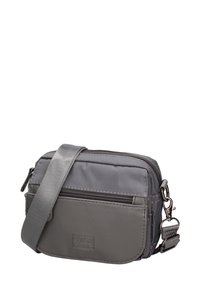 Borsa a tracolla grigia realizzata in tessuto resistente, con tasca anteriore con zip, tracolla regolabile e dettaglio del logo sul pannello frontale.