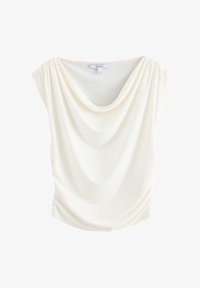 Blusa sin mangas de color crema con escote drapeado y sutil recogido en los laterales, mostrada sobre un fondo blanco.