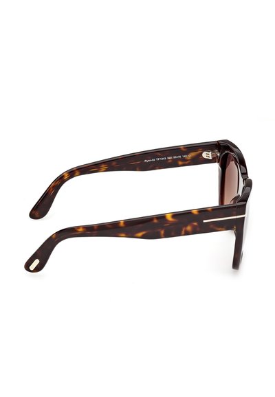 Gafas de sol con montura rectangular gruesa y patrón carey, con lentes tintadas marrones, mostradas de perfil sobre un fondo blanco.