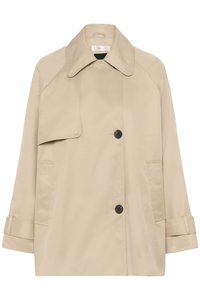 Bézs színű ballonkabát kétsoros gombolással, nagy gallérral, fekete gombokkal és oldalzsebekkel. Sima tapintású, laza szabású.