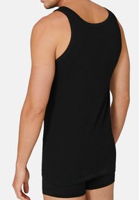 Black sleeveless tank top made of soft cotton, with a smooth texture and a relaxed fit, showing the back view and side of the torso.