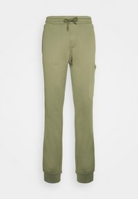 Olivově zelené slim-fit tepláky s elastickým pasem, šňůrkou, boční kapsou na cargo a ribbenými manžetami.